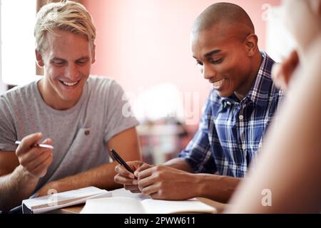 Working hard for good grades. university students during class. Stock Photo