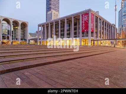 Lincoln Center at dawn: David Geffen Hall, on Josie Robertson Plaza, with Metropolitan Opera House at left (2017). Stock Photo