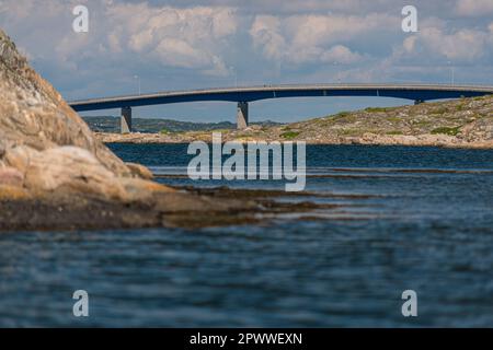 Gothenburg, Sweden - June 07 2014: Barren cliffs by the sea and the Fotö bridge. Stock Photo