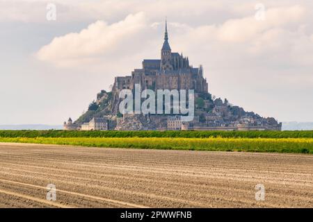 Beautiful panoramic view of famous Le Mont Saint-Michel tidal island with blue sky. Normandy, northern France Stock Photo