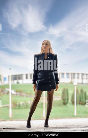 Full length urban portrait of confident woman outdoors Stock Photo