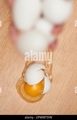 broken egg on the floor in kitchen, top view Stock Photo