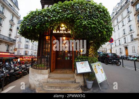 The traditional French restaurant Le Basilic located in picturesque Montmartre district of Paris. Stock Photo