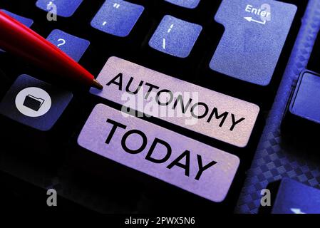 Hand writing sign Autonomy, Business concept vehicle that can guide itself without human conduction Stock Photo