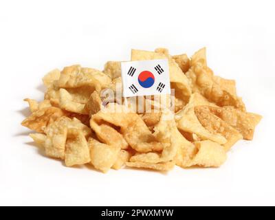 Pile of Crispy Fried Wontons With Flag of Korea Isolated on White Stock Photo