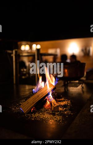 Open fireplace in a cosy restaurant Stock Photo