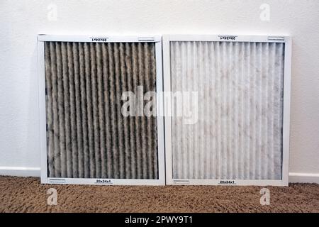 Comparison of clean and heater dirty air conditioning filters Stock Photo