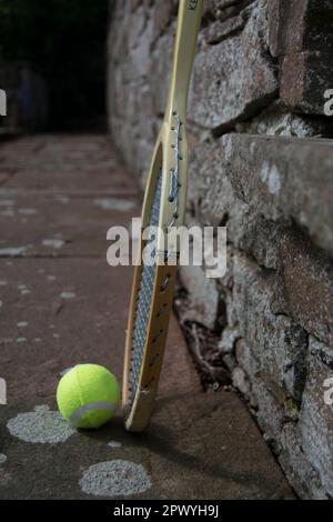 Tennis Racket Path Three tennis balls and vintage racket on the path Stock Photo - Alamy