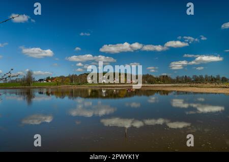 Pond with blue water near Rybnicna village in spring sunny color day Stock Photo