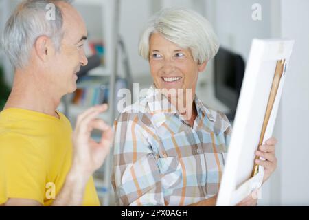 happy senior couple doing diy Stock Photo
