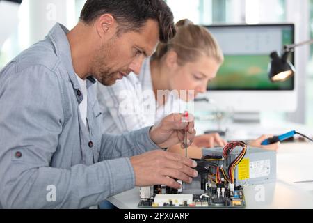 team of technicians working together Stock Photo