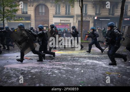 Paris, France. 01st May, 2023. Paris, FR 01 May, 2023. The police charge at protesters. Thousands turn out for the May Day Rallies. Protests have been seen since Emmanuel Macron introduced the pension reform, which increases the age for retirement from 62 to 64. Historically the 1st of May marks International Labor Day which commemorates labourers and the working class. Credit: Andy Barton/Alamy Live News Stock Photo