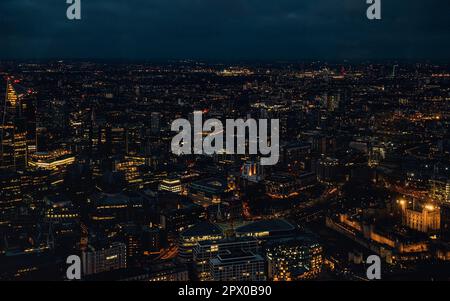 Aerial view of north east London, just after dark, orange yellow street lights starting to glow Stock Photo