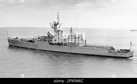 AJAXNETPHOTO. AUGUST, 1974. PORTSMOUTH, ENGLAND - FRIGATE HMS PLYMOUTH DEPARTS NAVAL BASE. ROTHESAY CLASS FRIGATE BUILT AT DEVONPORT DOCKYARD 1959. IN 1982, PLYMOUTH WAS ONE OF FIRST BRITISH WARSHIPS TO ARRIVE IN SOUTH ATLANTIC DURING THE FALKLANDS ISLANDS CONFLICT, TAKING PART IN RECAPTURE OF SOUTH GEORGIA DURING OPERATION PARAQUET.  PHOTO:JONATHAN EASTLAND/AJAX REF:232404 83 Stock Photo