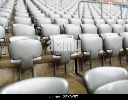 Empty gray chairs inside a stadium. Plastic seats arranged in rows. Repetition and symmetry. Stock Photo