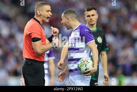 Branko Pauljevic of Ujpest FC competes for the ball with Tokmac