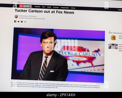 Reaction on CNN Business website with breaking news following the sacking of Fox News presenter Tucker Carlson on  24th April 2023. Stock Photo
