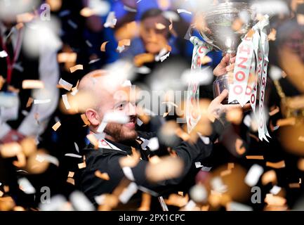 Luca Brecel celebrates with the trophy after beating Mark Selby to win the final on day seventeen of the Cazoo World Snooker Championship at the Crucible Theatre, Sheffield. Picture date: Monday May 1, 2023. Stock Photo