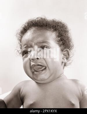 1940s 1950s CRYING AFRICAN-AMERICAN BABY GIRL - n371 HAR001 HARS COPY SPACE AFRO CRY EXPRESSIONS TROUBLED B&W CONCERNED SADNESS WIDE ANGLE WEEPING HEAD AND SHOULDERS AFRICAN-AMERICANS AFRICAN-AMERICAN BLACK ETHNICITY BAWLING MOOD SOBBING CONCEPTUAL GLUM DISAPPOINTED EMOTION EMOTIONAL EMOTIONS GROWTH JUVENILES MISERABLE BABY GIRL BLACK AND WHITE DISPLEASED DISTRAUGHT DISTURBED HAR001 HOSTILE INCENSED OLD FASHIONED AFRICAN AMERICANS Stock Photo