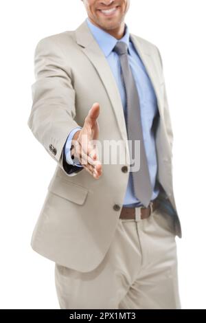 Welcome to the firm. Studio portrait of a handsome young businessman extending his hand to the camera. Stock Photo