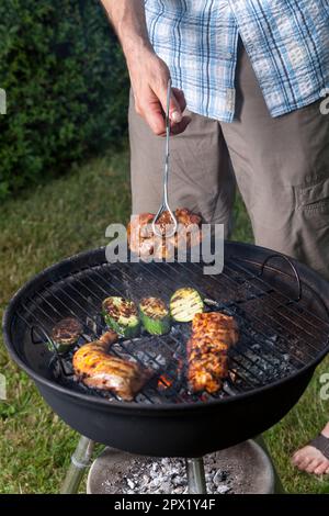 grill cooking out in the backyard Stock Photo
