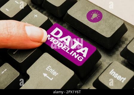 Hand writing sign Data Modeling, Business idea process of transferring data between data storage systems Stock Photo