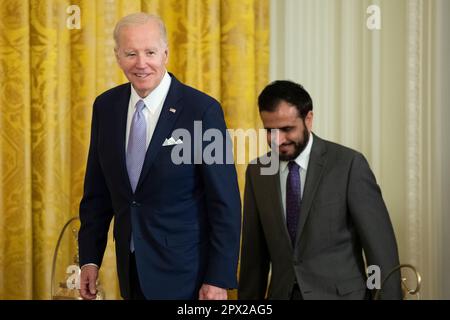 Washington, United States. 01st May, 2023. US President Joe Biden (L) and Imam Makhdoom Zia (R) arrive for a celebration of Eid-al-Fitr, in the East Room of the White House, in Washington, DC, USA, 01 May 2023. Credit: Sipa USA/Alamy Live News Stock Photo