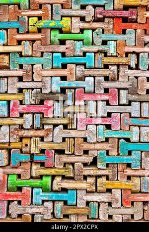Close up of colorful stacked h-shaped wooden struts for concrete shuttering Stock Photo