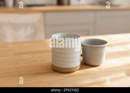 Beautiful closeup of unique handmade two cups. Stock Photo