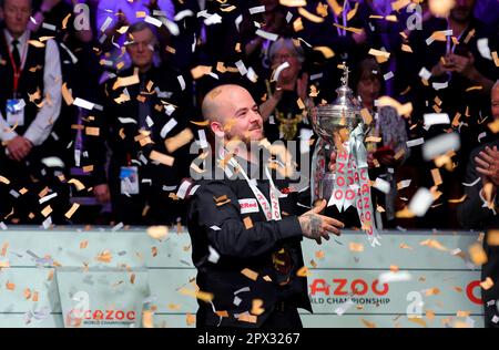 Sheffield, Britain. 1st May, 2023. Luca Brecel of Belgium celebrates with the trophy after the final against Mark Selby of England at the World Snooker Championship in Sheffield, Britain, May 1, 2023. Credit: Zhai Zheng/Xinhua/Alamy Live News Stock Photo