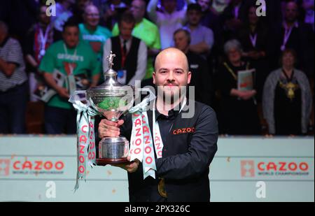 Sheffield, Britain. 1st May, 2023. Luca Brecel of Belgium celebrates with the trophy after the final against Mark Selby of England at the World Snooker Championship in Sheffield, Britain, May 1, 2023. Credit: Zhai Zheng/Xinhua/Alamy Live News Stock Photo