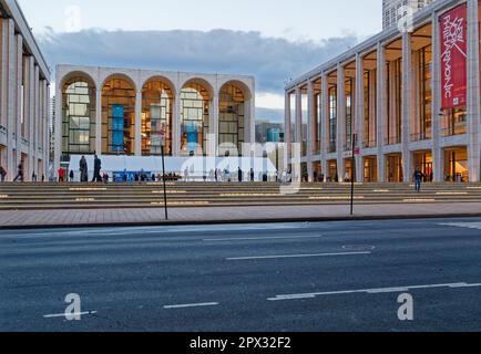 Lincoln Center at dawn: David Geffen Hall, on Josie Robertson Plaza, with Metropolitan Opera House at left (2016). Stock Photo