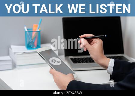 Sign displaying You Talk, We Listen, Word for Two Way Communication Motivational Conversation Stock Photo