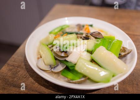 Fried Loofah gourd with Clam Stock Photo