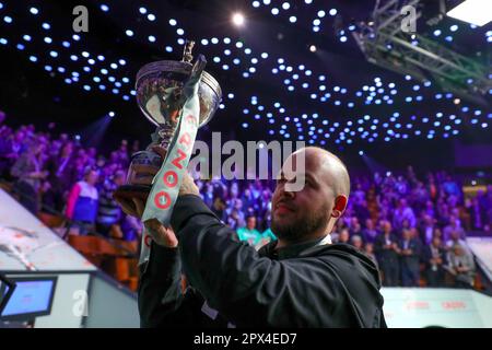 Sheffield, Britain. 1st May, 2023. Luca Brecel of Belgium celebrates with the trophy after winning the final against Mark Selby of England at the World Snooker Championship in Sheffield, Britain, May 1, 2023. Credit: Zhai Zheng/Xinhua/Alamy Live News Stock Photo