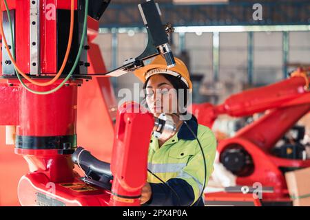 Robotic technicians perform regular maintenance by inspecting, testing, and repairing machinery and engines to ensure they stay in standard condition. Stock Photo