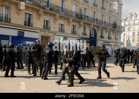 Paris, France. 27th Jan, 2023. A police officer arrests one of the protesters during a demonstration in Nation square. Demonstrations over the increase in the retirement age (from 62 to 64) continue today on the occasion of May Day (International Labours Day) in Paris, which have turned into clashes between protesters and police. Credit: SOPA Images Limited/Alamy Live News Stock Photo