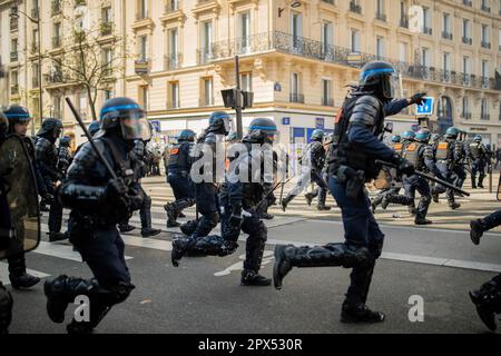 Paris, France. 27th Jan, 2023. Police charges towards violent protesters with shields and batons during a demonstration in Nation square. Demonstrations over the increase in the retirement age (from 62 to 64) continue today on the occasion of May Day (International Labours Day) in Paris, which have turned into clashes between protesters and police. Credit: SOPA Images Limited/Alamy Live News Stock Photo