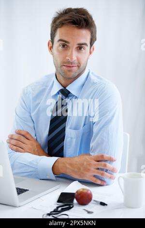 The modern professional. a handsome young businessman at work. Stock Photo