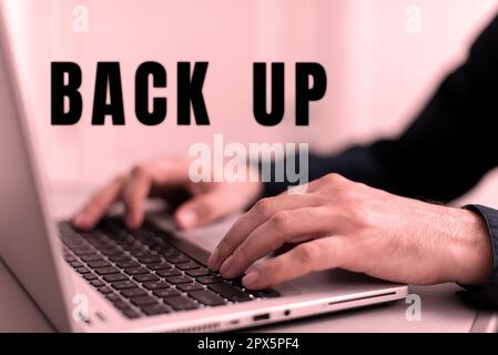 Text caption presenting Back Up, Word for saving important data into internet cloud and restore them later Stock Photo