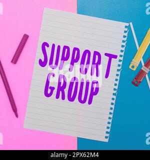 Sign displaying Support Group, Word for number of people involved in service commitment Stock Photo