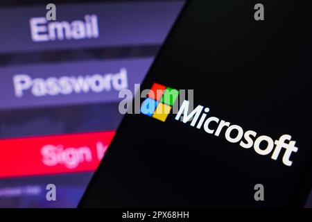Brazil. 01st May, 2023. In this photo illustration, the Microsoft Corporation logo is displayed on a smartphone screen, next to a login screen, with email, password, and sign in. Credit: SOPA Images Limited/Alamy Live News Stock Photo