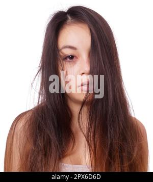 sad young asian woman with disheveled hair and red eyes from crying Stock Photo