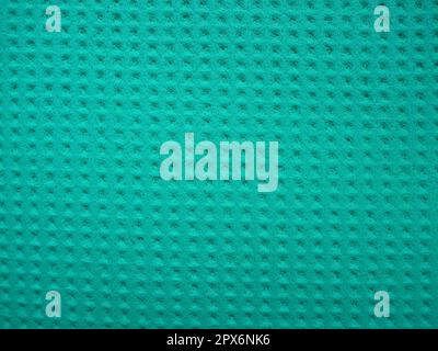 Sponge fibers sponge texture pattern surface close-up green background. Stock Photo