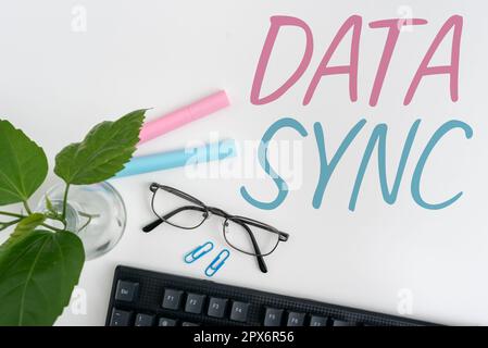 Handwriting text Data Sync, Business concept data that is continuously generated by different sources Stock Photo