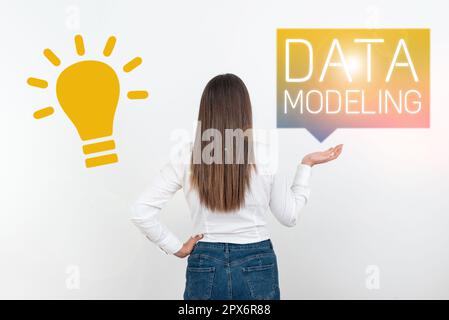 Text caption presenting Data Modeling, Business concept process of transferring data between data storage systems Stock Photo