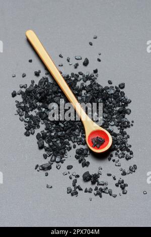 Black Hawaiian salt on spoon, sea salt with activated charcoal Stock Photo