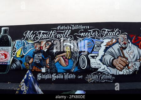 A colorful advertisement for Singha Soda water on a wall in the  historical neighborhood of Talat Noi in Bangkok, Thailand. Stock Photo