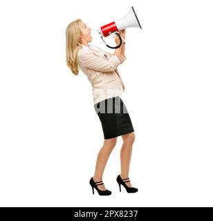 Making herself heard. a mature businesswoman shouting into a loudhailer against a studio background. Stock Photo