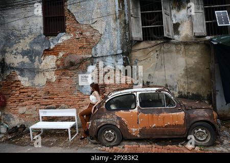 Walking through the historical neighborhood of Talat Noi in Bangkok, Thailand. Stock Photo